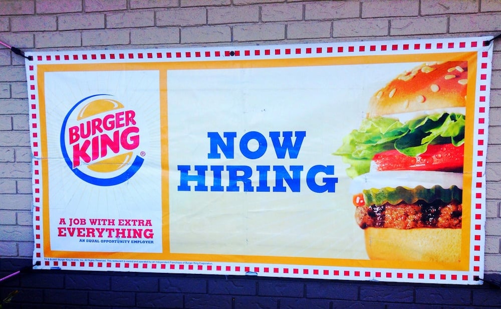 A now hiring image at Burger King. Millennials can be challenging to recruit and retain.